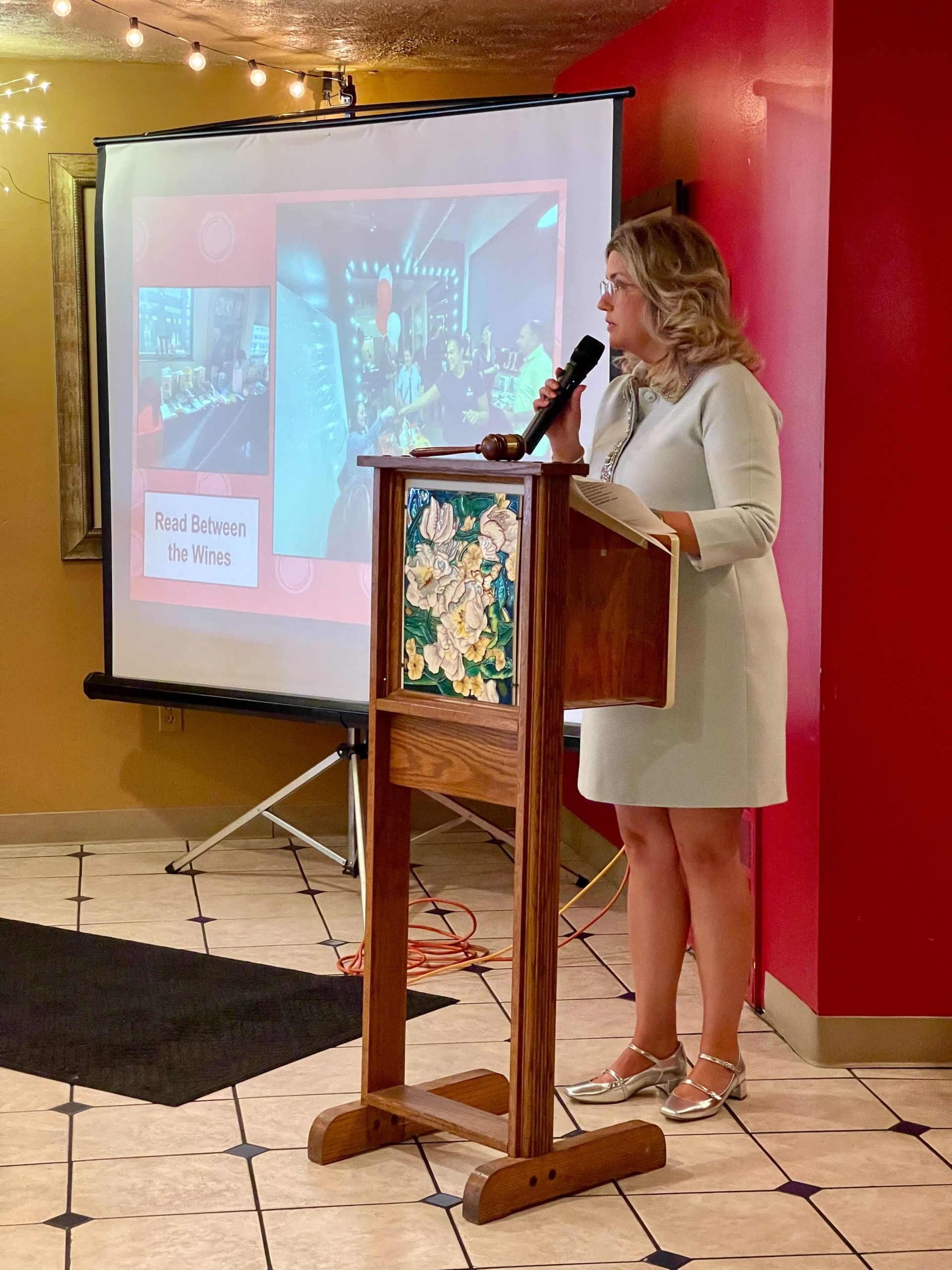 Junior League of Dayton President Emilee Ambrose presenting during the Annual Dinner year in review
